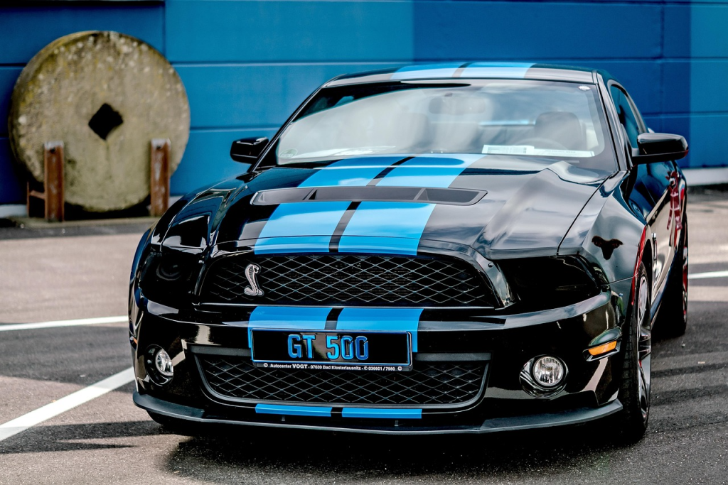 a blue mushtang to show the real cost of renting a ford mushtang